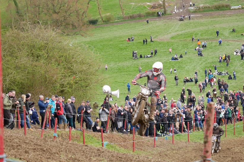 Racer jumping near top of hill climb - Photo credits: Nye Davis