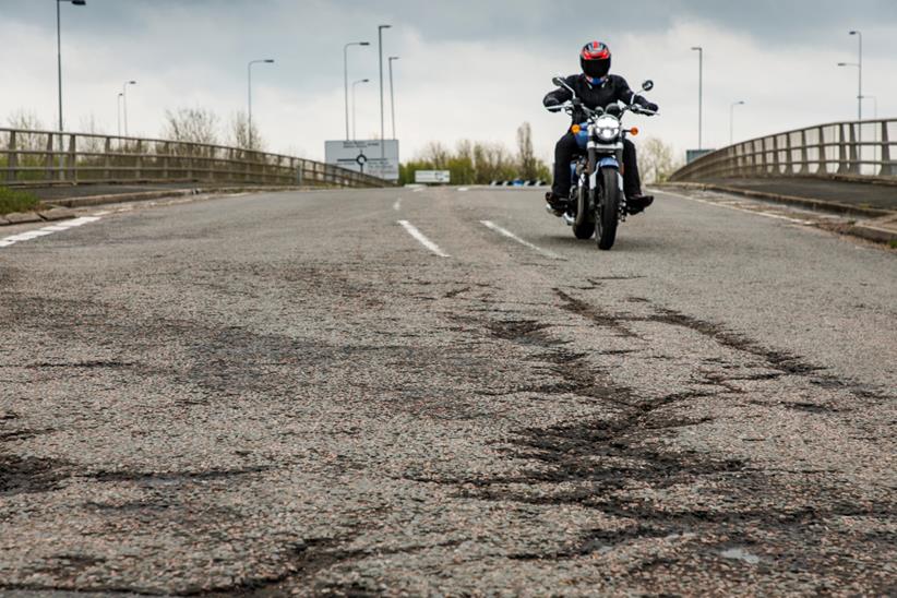 Rider approached broken up road section