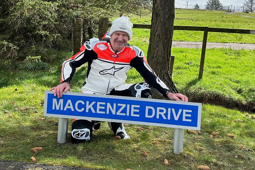 Niall Mackenzie poses with the sign for Mackenzie Drive at Knockhill