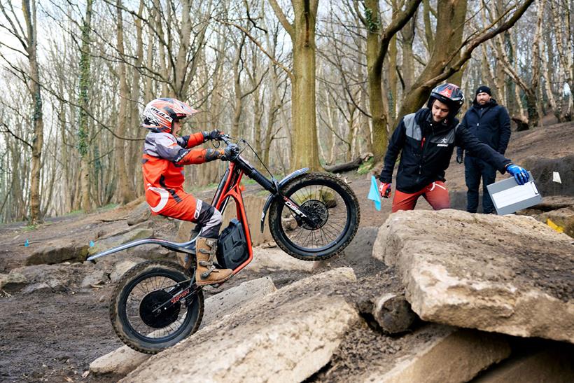 Young riders tackles a tricky rock slab on his electric Oset