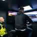 Police watch rider try the simulator