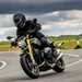 BMW R12 nineT riding through a right hand bend with bike and rider leaning into the corner