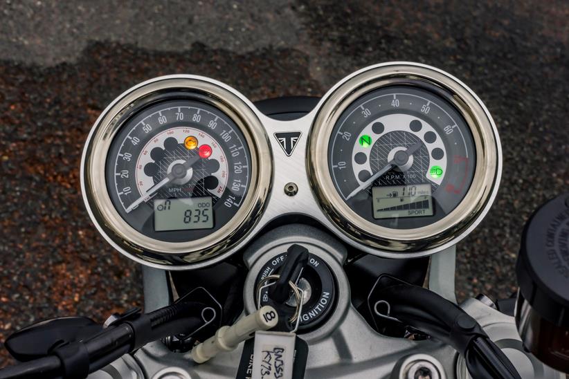 Triumph Speed Twin 1200 close up of dash showing the blend of analogue clocks and including digital odometer