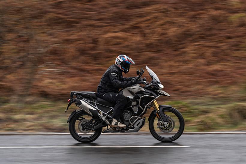 2024 Triumph Tiger 1200 Rally Pro and Explorer side profile of the bike riding past