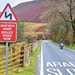 Motorcyclist in Wales approaching 'slow' sign