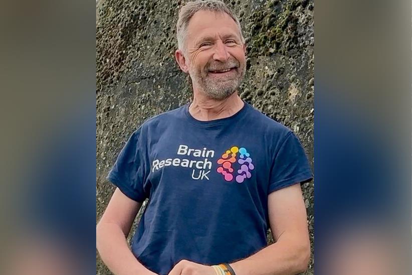 Andy poses for a picture wearing a Brain Research UK t-shirt