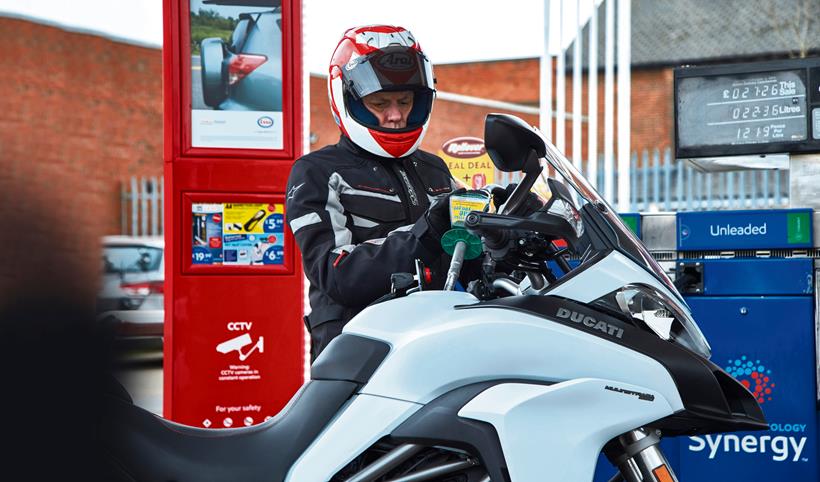 Motorcyclist fills Ducati Multistrada with petrol