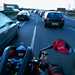 A motorbike filtering through traffic