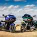 2024 Indian Challenger Dark Horse vs Harley-Davidson Road Glide parked on the sand pointing towards the camera