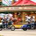 Indian Challenger Dark Horse vs Harley-Davidson Road Glide - riding past a carousel