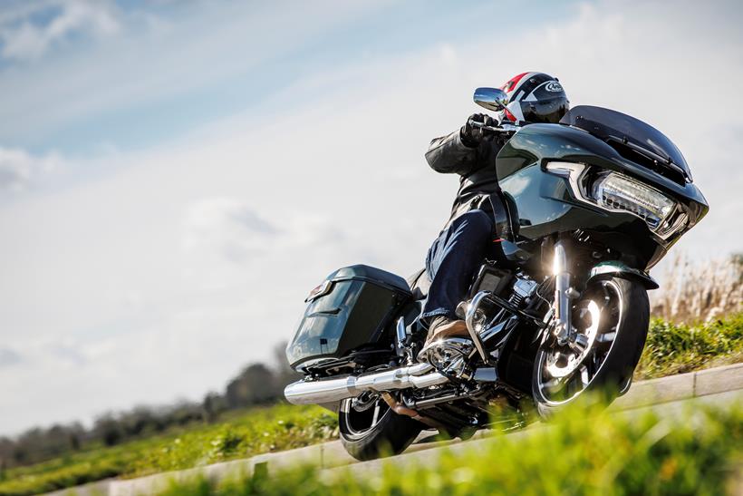 Indian Challenger Dark Horse vs Harley-Davidson Road Glide - front end shot of the bike riding into a left hand corner