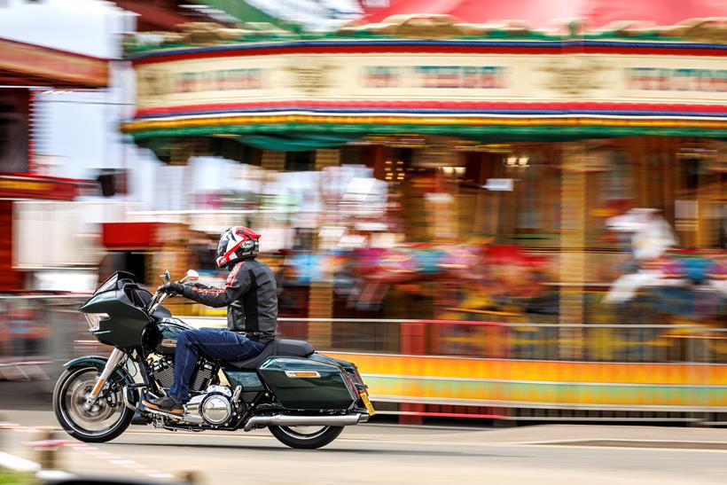 Indian Challenger Dark Horse vs Harley-Davidson Road Glide - Harley riding past a fair