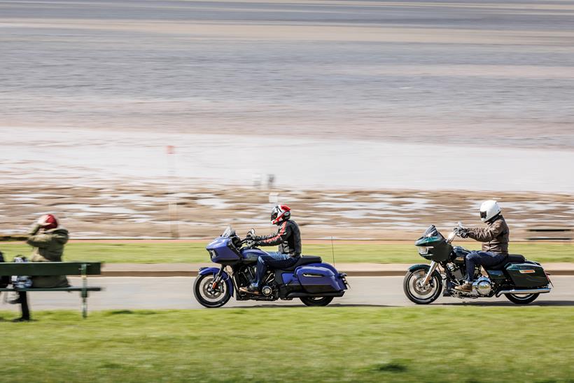 2024 Indian Challenger Dark Horse vs Harley-Davidson Road Glide riding down the seafront 