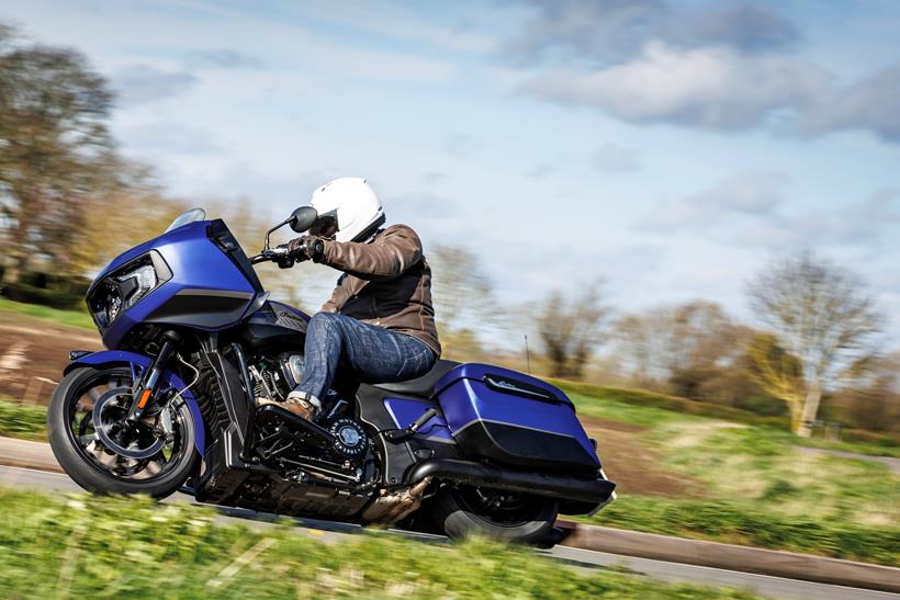 2024 Indian Challenger Dark Horse vs Harley-Davidson Road Glide Indian leaning into a right hand bend