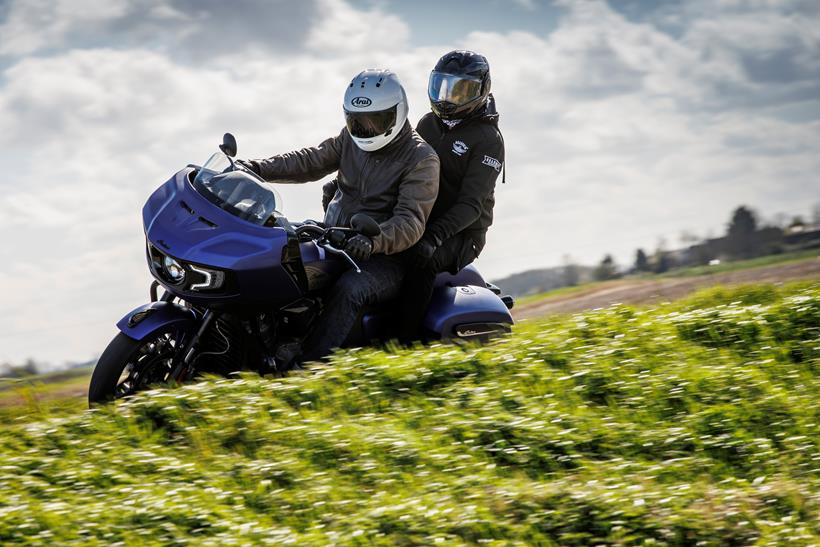 2024 Indian Challenger Dark Horse vs Harley-Davidson Road Glide - side shot of Indian with pillion