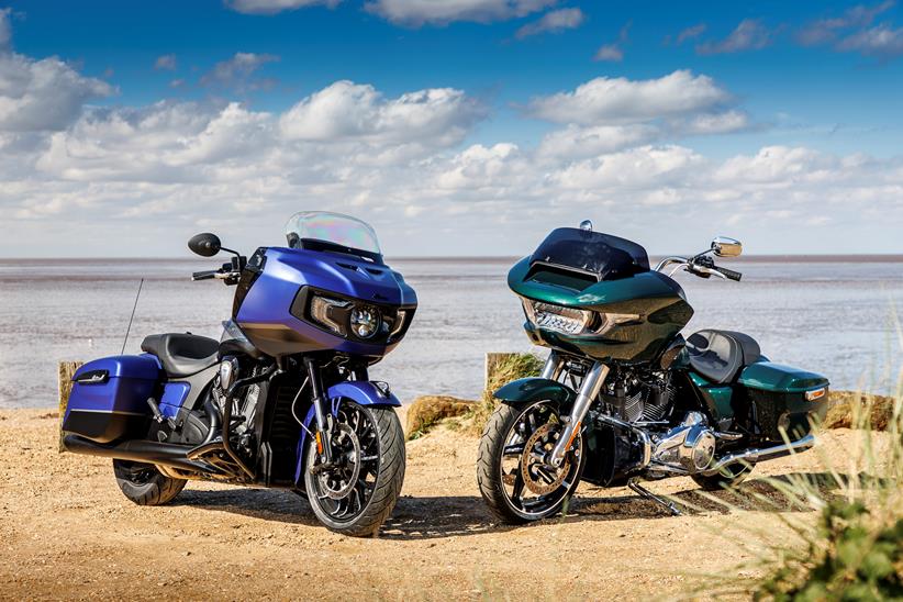 2024 Indian Challenger Dark Horse vs Harley-Davidson Road Glide parked on the sand pointing towards the camera