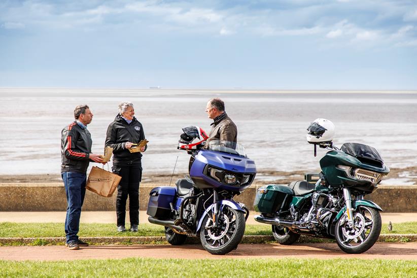 2024 Indian Challenger Dark Horse vs Harley-Davidson Road Glide the team deciding which bike to crown king bagger standing by the seafront