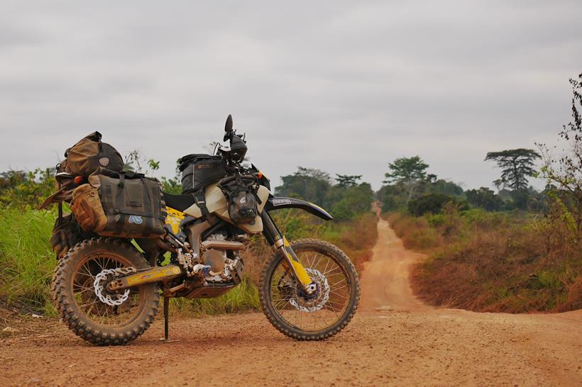 The Adventure Spec Magadan MK3 panniers, pictured on a dirt road in Africa