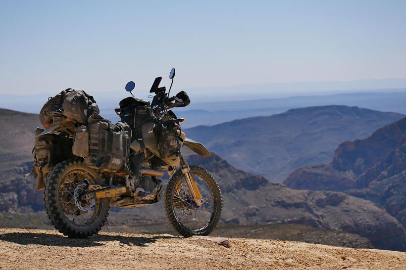 The Adventure Spec Magadan MK3 panniers, pictured on a mountain range in Africa