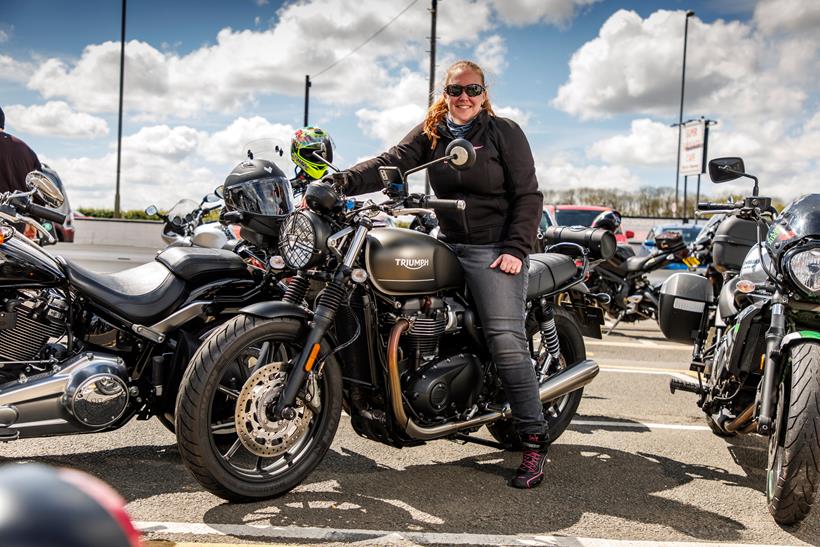 A motorcyclist sat on a Triumph Bonneville