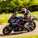 2024 BMW M1000XR Deep dive - riding past camera on sunny road