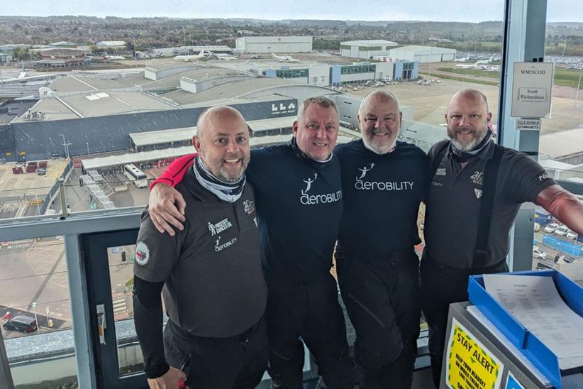 The four riders in an air traffic controller tower