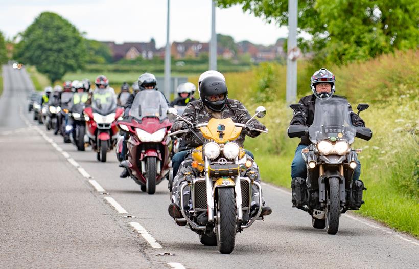 Motorcycles riding in a mass group