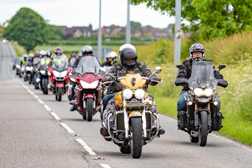 Motorcycles riding in a mass group