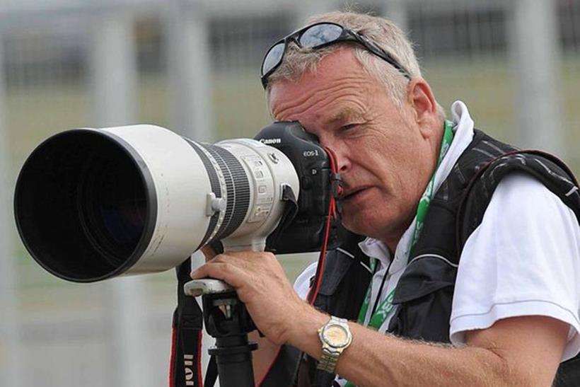 Photographer Graham Holt taking pictures at a MotoGP round