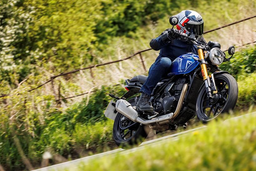 2024 Triumph Speed - riding past on a country lane 