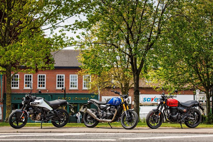 2024 Triumph Speed 400, Royal Enfield HNTR 350, Husqvarna Vitpilen 401 Group Test - static shot outside pub