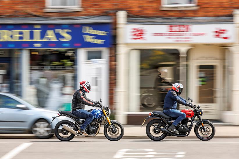 2024 Triumph Speed 400 and Royal Enfield 350 - riding past camera on high street