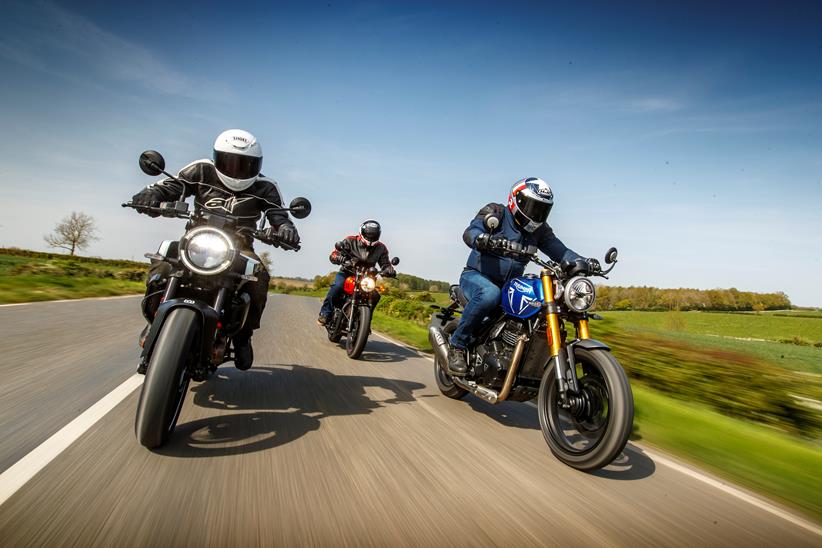 2024 Triumph Speed 400, Royal Enfield HNTR 350, Husqvarna Vitpilen 401 Group Test - riding on road towards the camera.