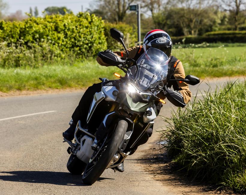 2024 Triumph Tiger 900 Rally Pro - cornering riding towards camera