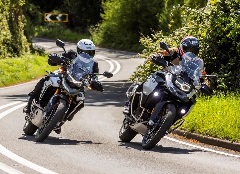 2024 BMW F900GSA and triumph tiger 900 Rally Pro - cornering on country road side by side