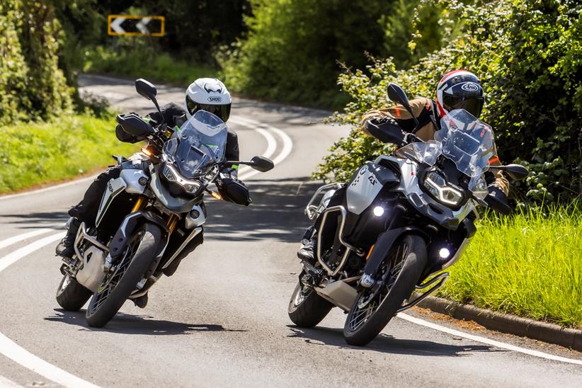 2024 BMW F900GSA and triumph tiger 900 Rally Pro - cornering on country road side by side