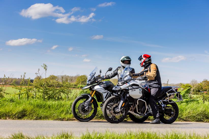 2024 BMW F900GSA and 2024 Triumph Tiger 900 Rally Pro - stationary with riders discussing