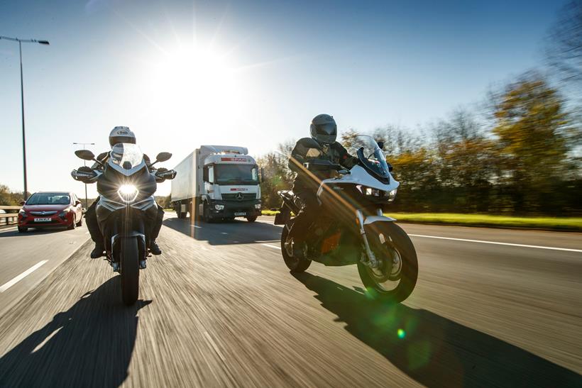 A petrol MV Agusta riding on a road with an electric Zero