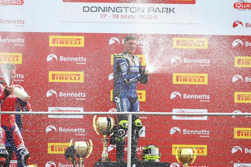 Kyle Ryde sprays the champagne after his victory at Donington Park.