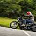 2024 Harley Davidson Nightster Special riding around a corner on a country road