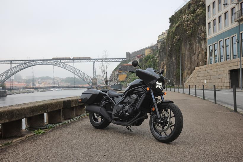 Honda CMX1100 Rebel parked on a street next to a river