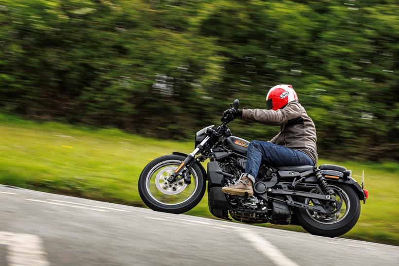 2024 Harley Davidson Nightster Special riding around a corner on a country road