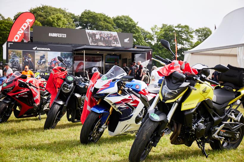 A Honda CB1000R, Fireblade, and CB750 Hornet on display