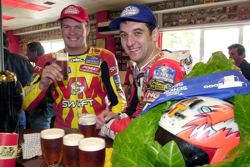 Michael Rutter drinking a beer with teammate David Jefferies