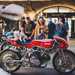 Visitors look at a Ducati custom motorcycle
