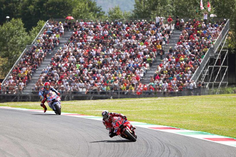 Pecco Bagnaia leads Marc Marquez during the sprint race at Mugello