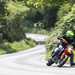 2024 KTM 690 SMC R cornering on a country road