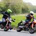 2024 Ducati Hypermotard 698 Mono RVE and the KTM 690 riding together round a corner