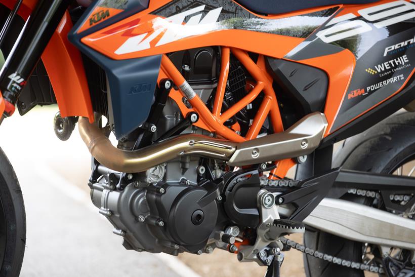 2024 KTM 690 SMC R static shot of the left hand engine side and trellis frame