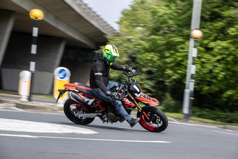 2024 Ducati Hypermotard 698 Mono RVE cornering in town round a roundabout 